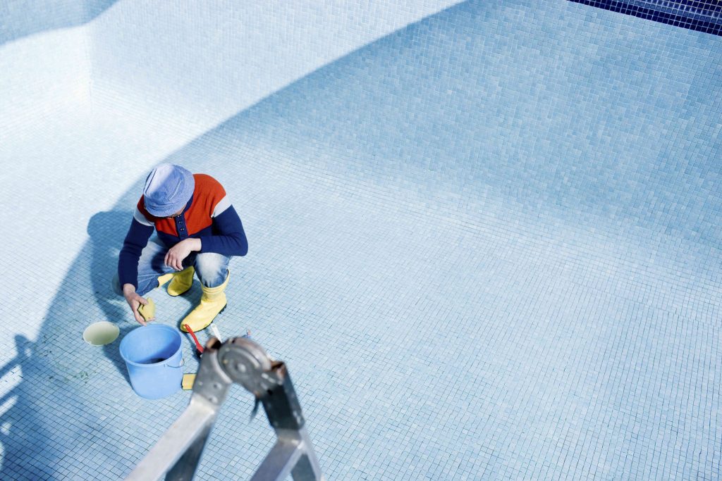 man-cleaning-tiled-pool-2025-04-04-12-22-58-utc-compressed