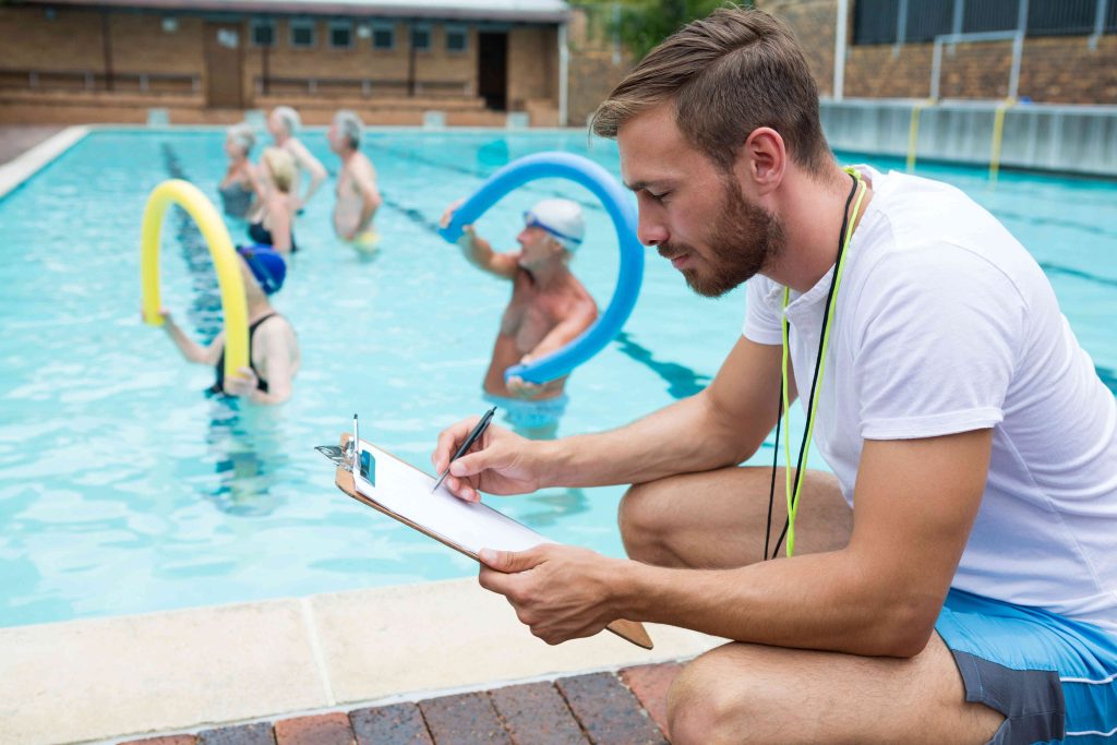 swim-coach-writing-on-clipboard-2025-04-03-10-48-11-utc-compressed